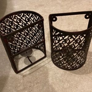 A pair (2) of bronze candleholders (wall sconces).  Can be hung outside.